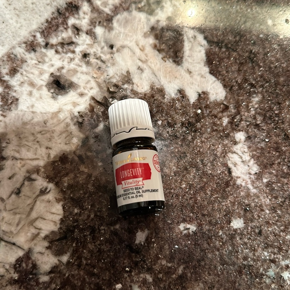 Brand new 5 ml bottle of Longevity essential oil.